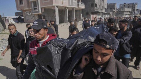 Palestinians carry the body of Ismail Barhoum, a member of Hamas’ political bureau who was killed is an Israeli army strike of Nasser Hospital in Khan Younis, Gaza Strip, Monday, March 24, 2025 | Photo Credit: AP